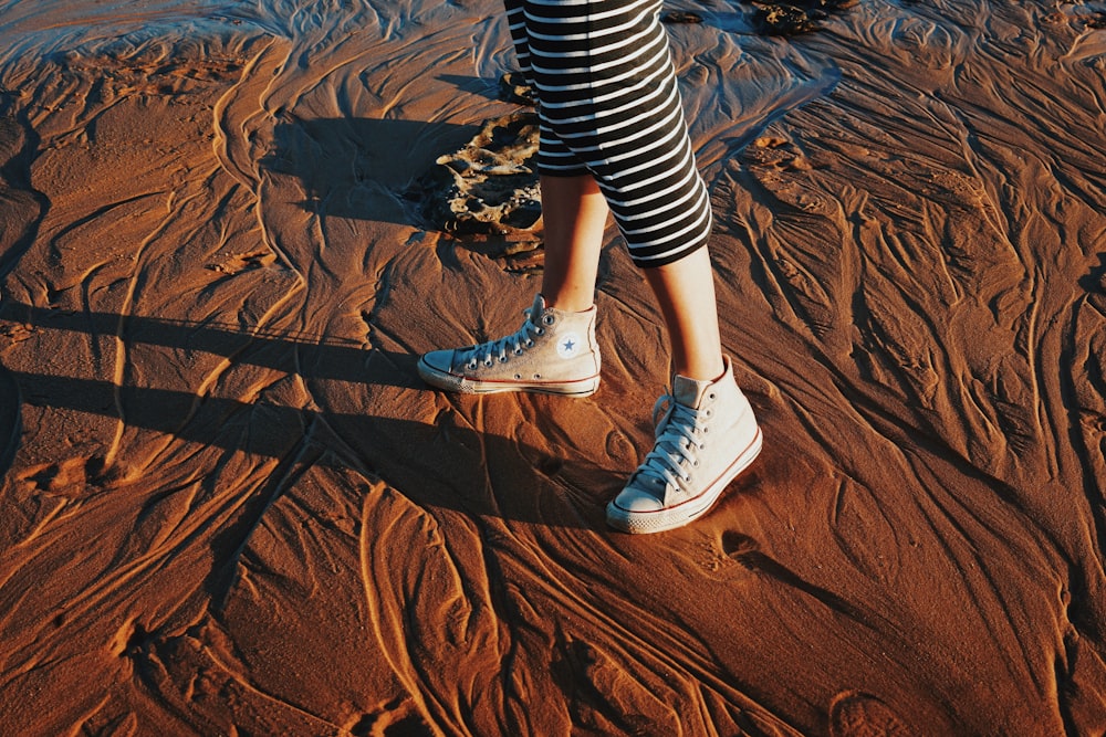 woman wearing white boots