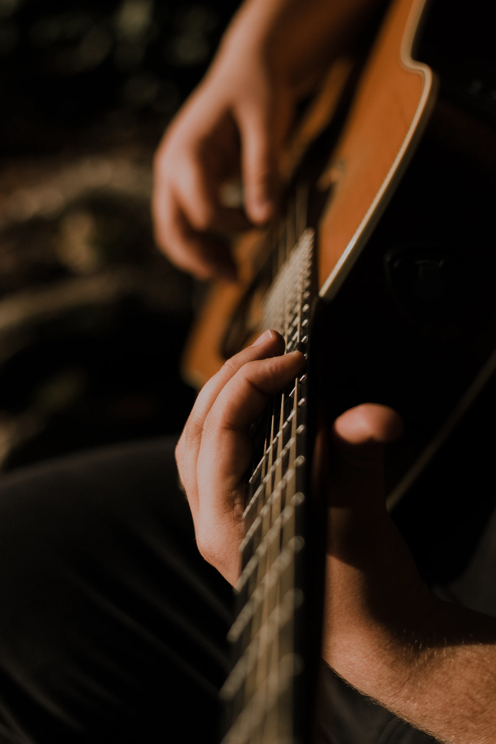 Acoustic guitar lesson in progress