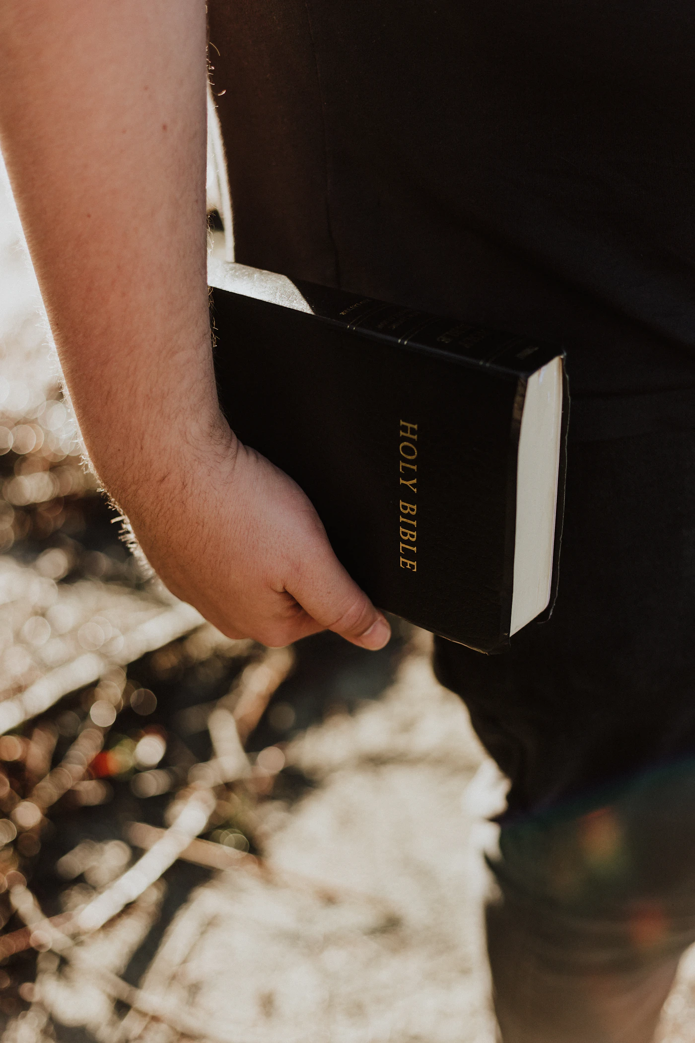 A person carrying an open Bible in a church