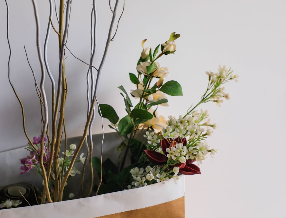 assorted flowers in shopping bag