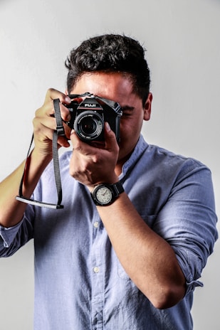 man holding camera \