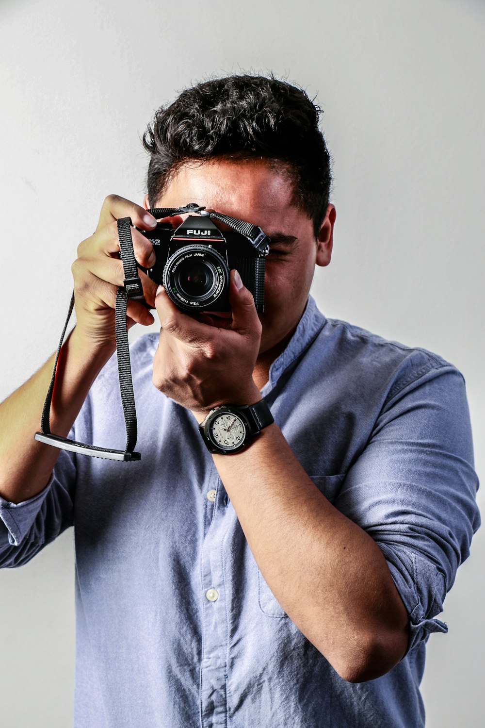 man holding camera \