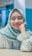 A smiling patient, Aisha K., post dental treatment at Dr. Abdullah's clinic.