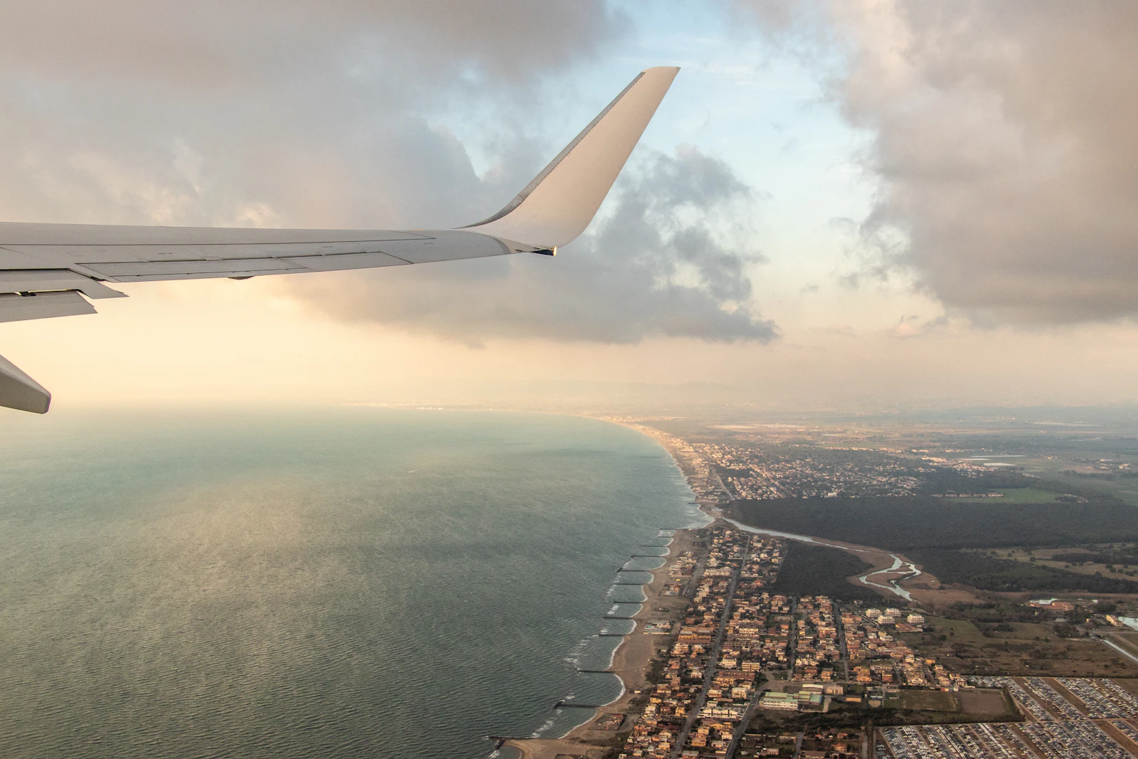 Plane flying over the coast near Fiumicino, Rome