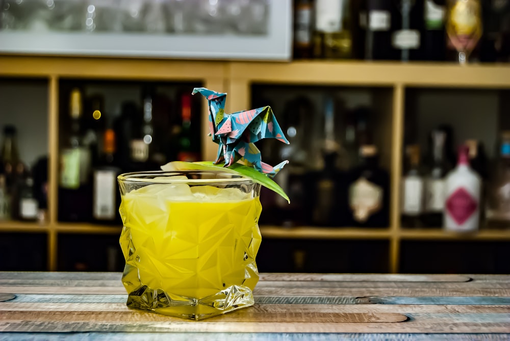 yellow liquid in clear drinking glass