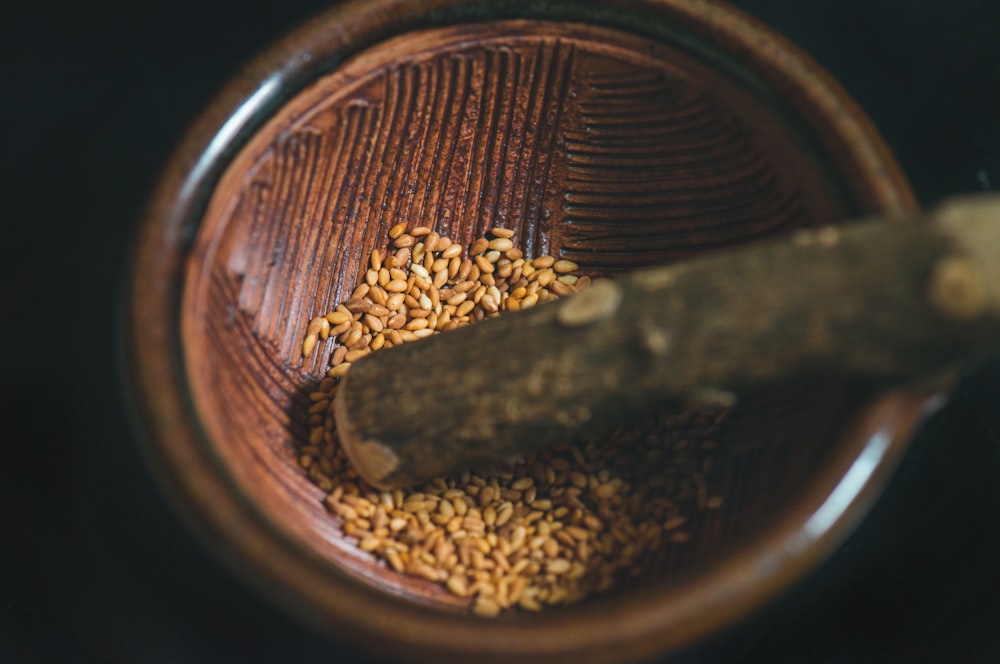 close up photo of brown seed inside bowl