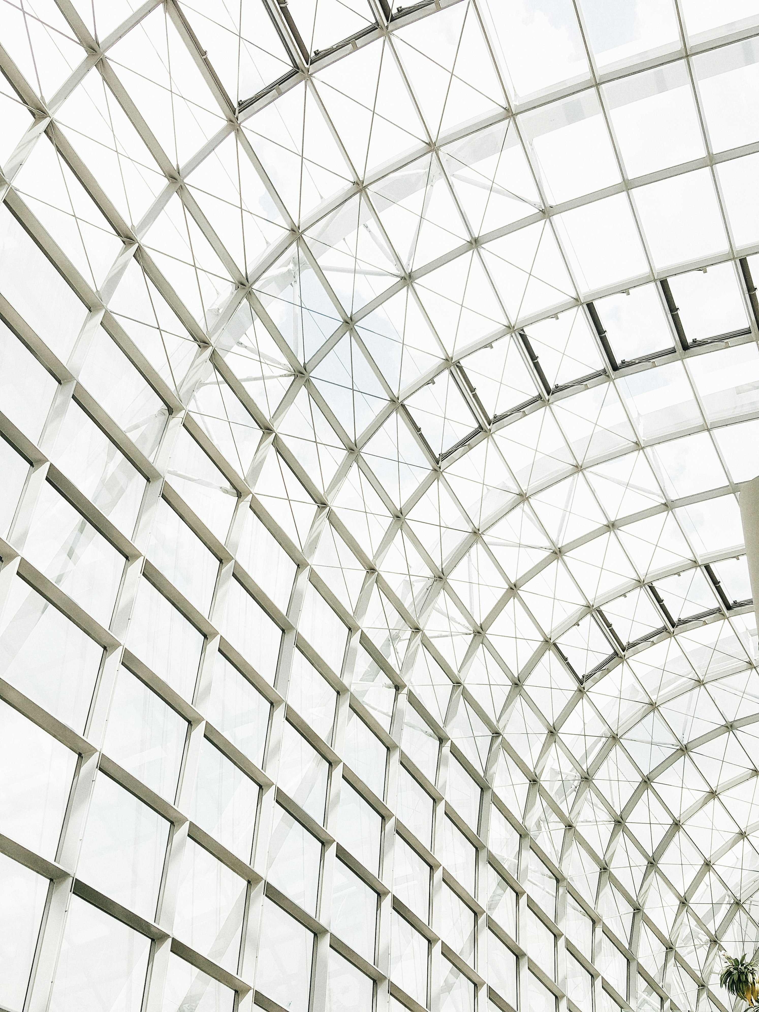 low angle photography of clear glass ceiling