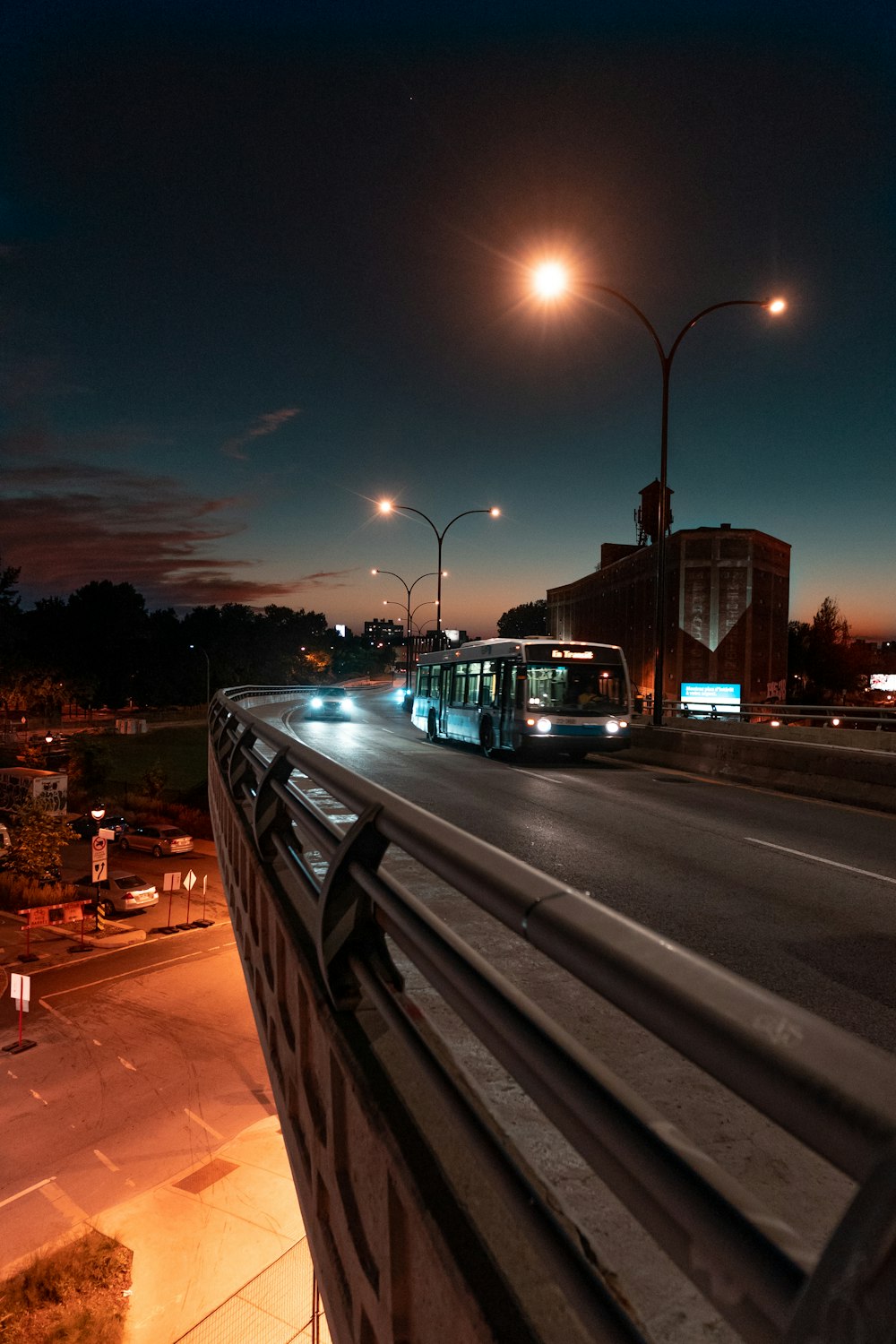 bus on road during nighttime