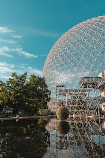 gray stainless steel globe landmark under green skies