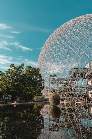 gray stainless steel globe landmark under green skies
