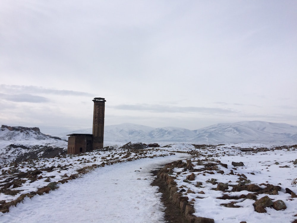 field covered with snow and pathway view