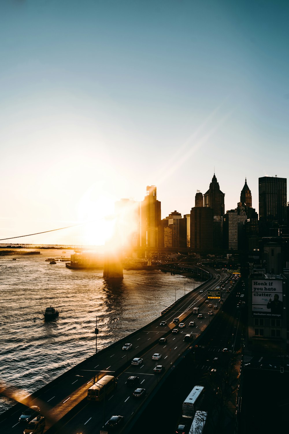 buildings by the body of water during golden hour