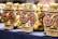 A collection of medals with a dragon design and text indicating 'Brovary 2018 Ukraine Open Championship Kata' displayed on a table. The medals are golden with red details and feature intricate designs.
