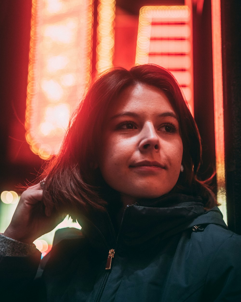 selective focus photo of woman wearing green turtleneck jacket