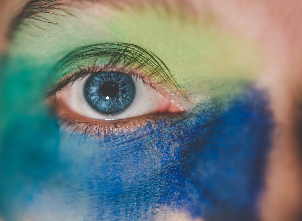 selective focus photograph of blue eye