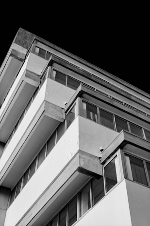 Elegant architectural shot capturing sharp lines and light contrasts in a modern building.