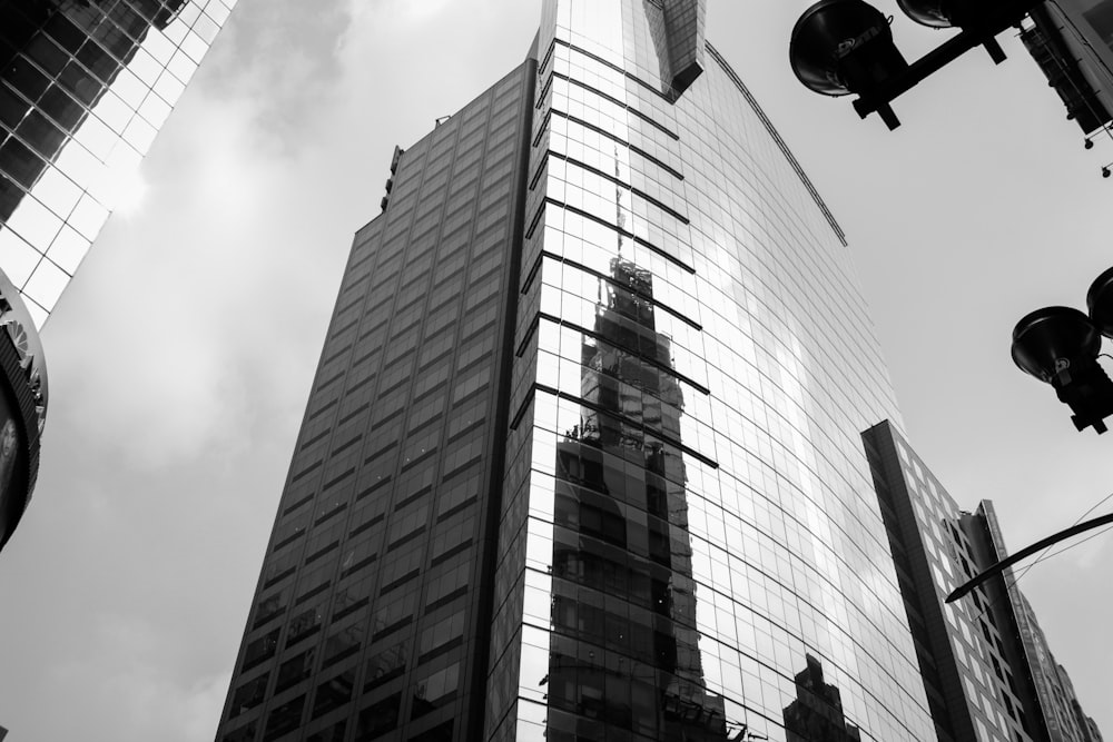 grayscale photography of curtain wall building