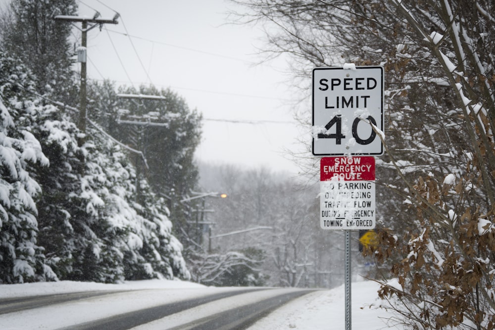 white and black speed limit signage