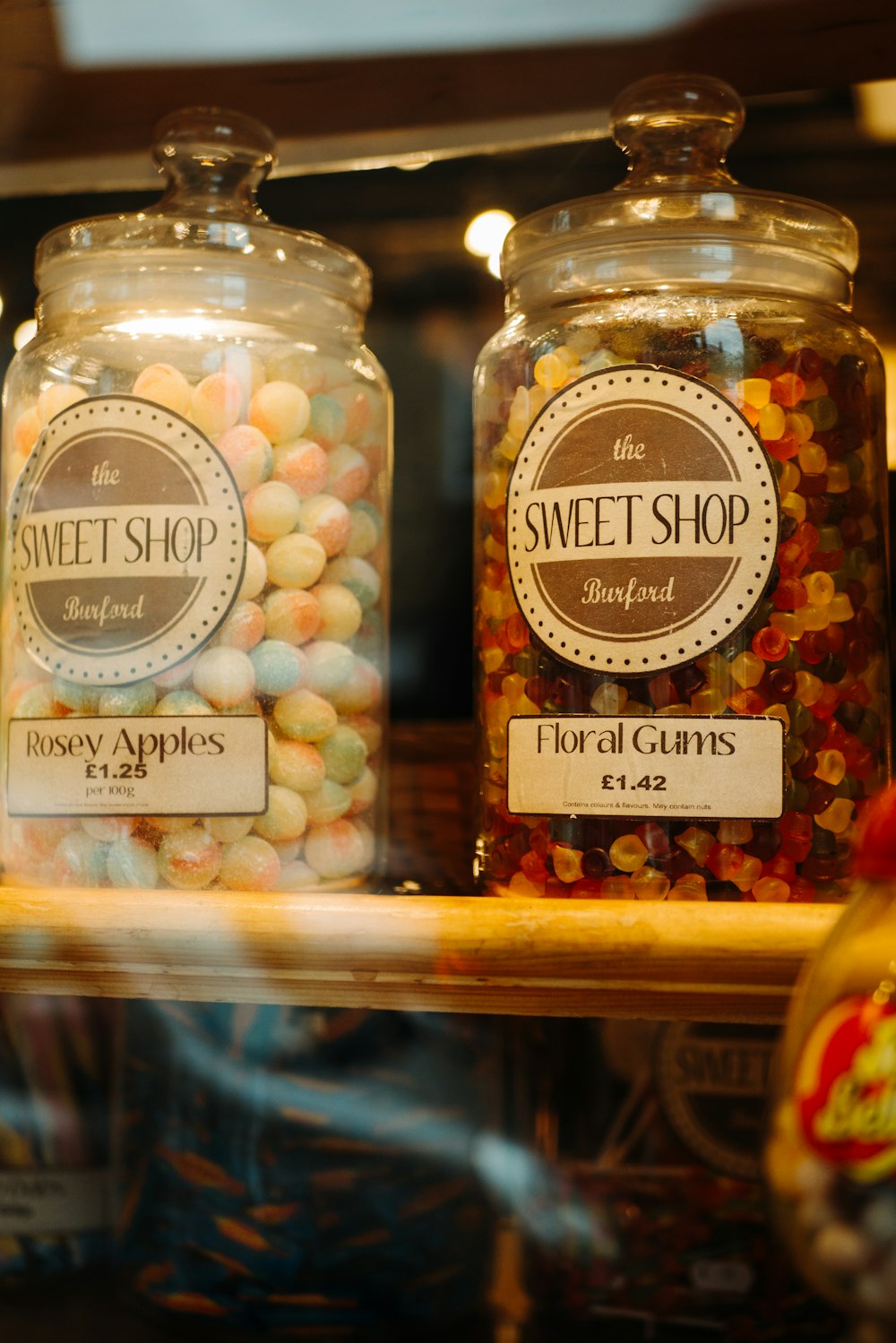 two clear glass canisters with candies