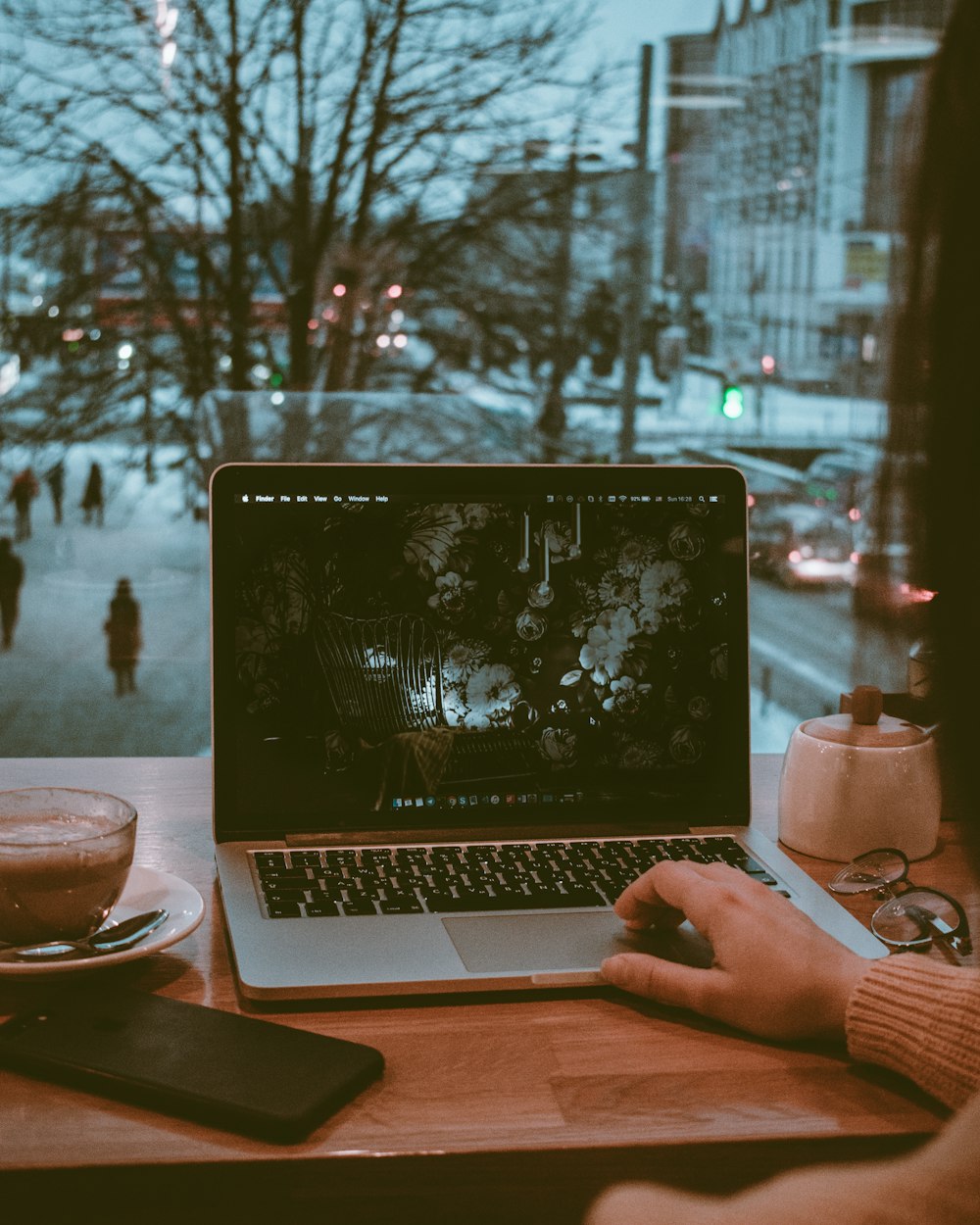 person using silver MacBook