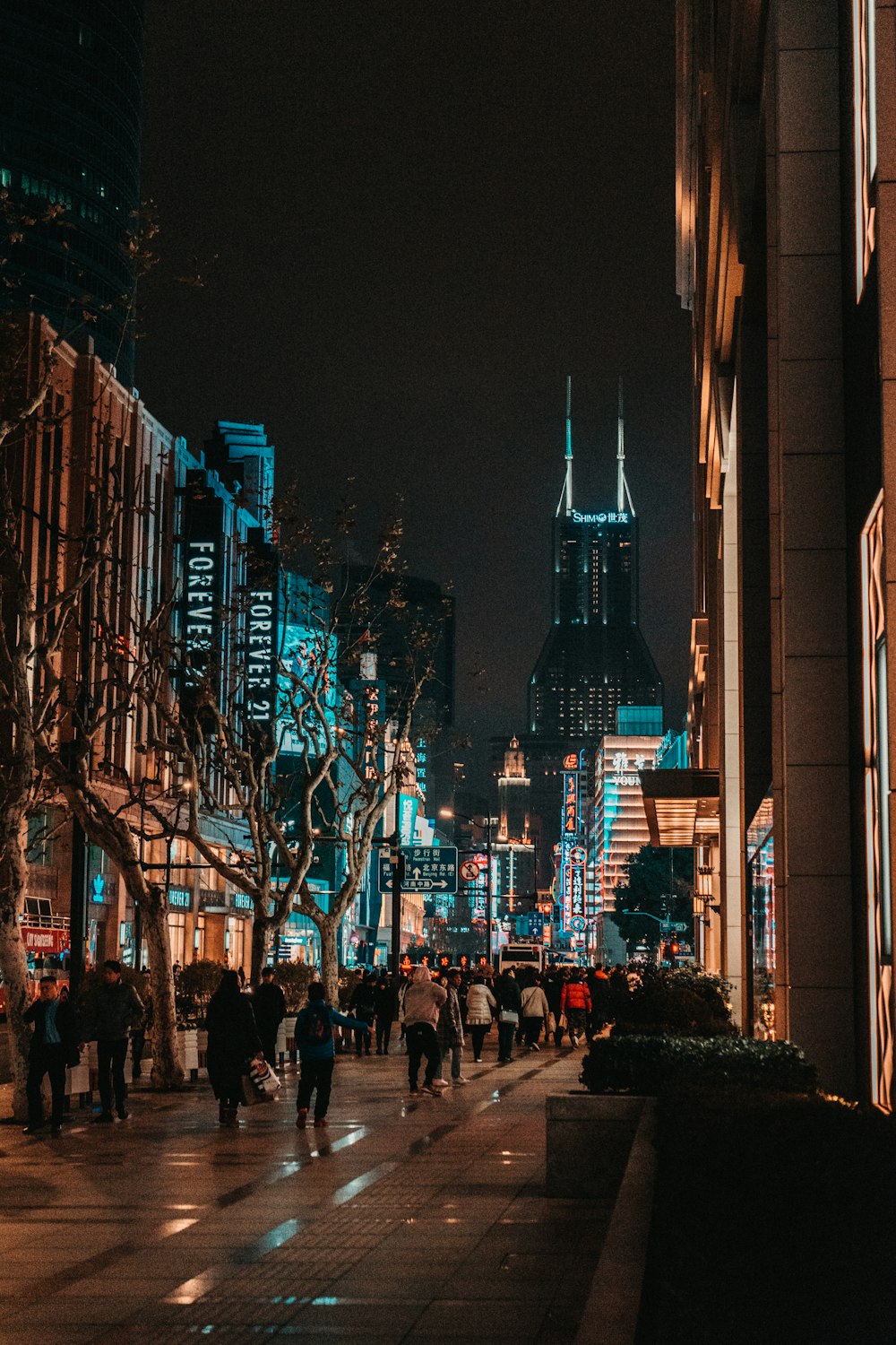 group of people standing near buildings