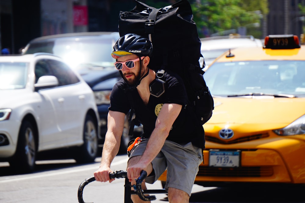 man riding on bicycle at daytime
