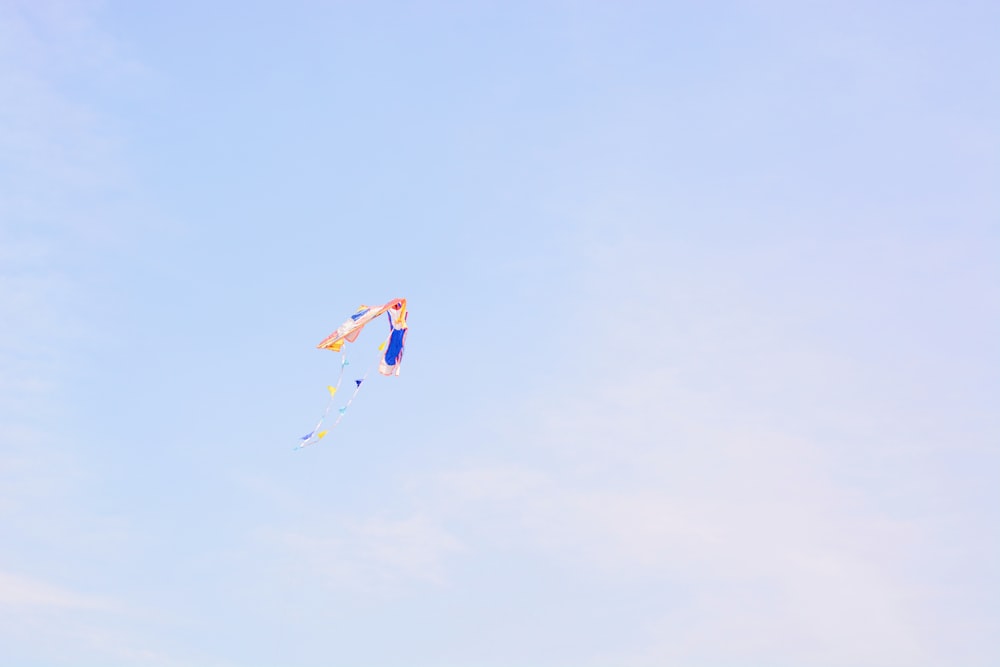 brown and blue kite at daytime