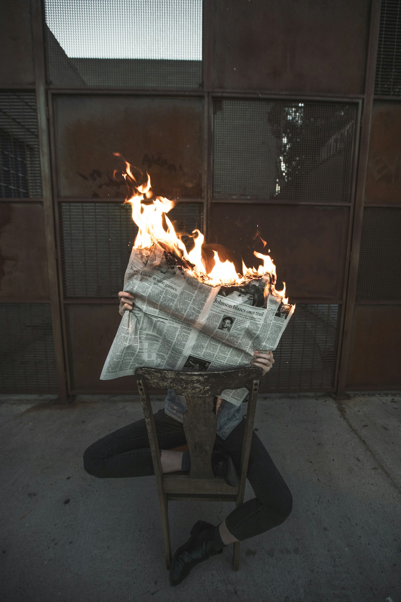 Sony a7R III + Canon EF 16-35mm F2.8L II USM sample photo. Person holding burning newspaper photography
