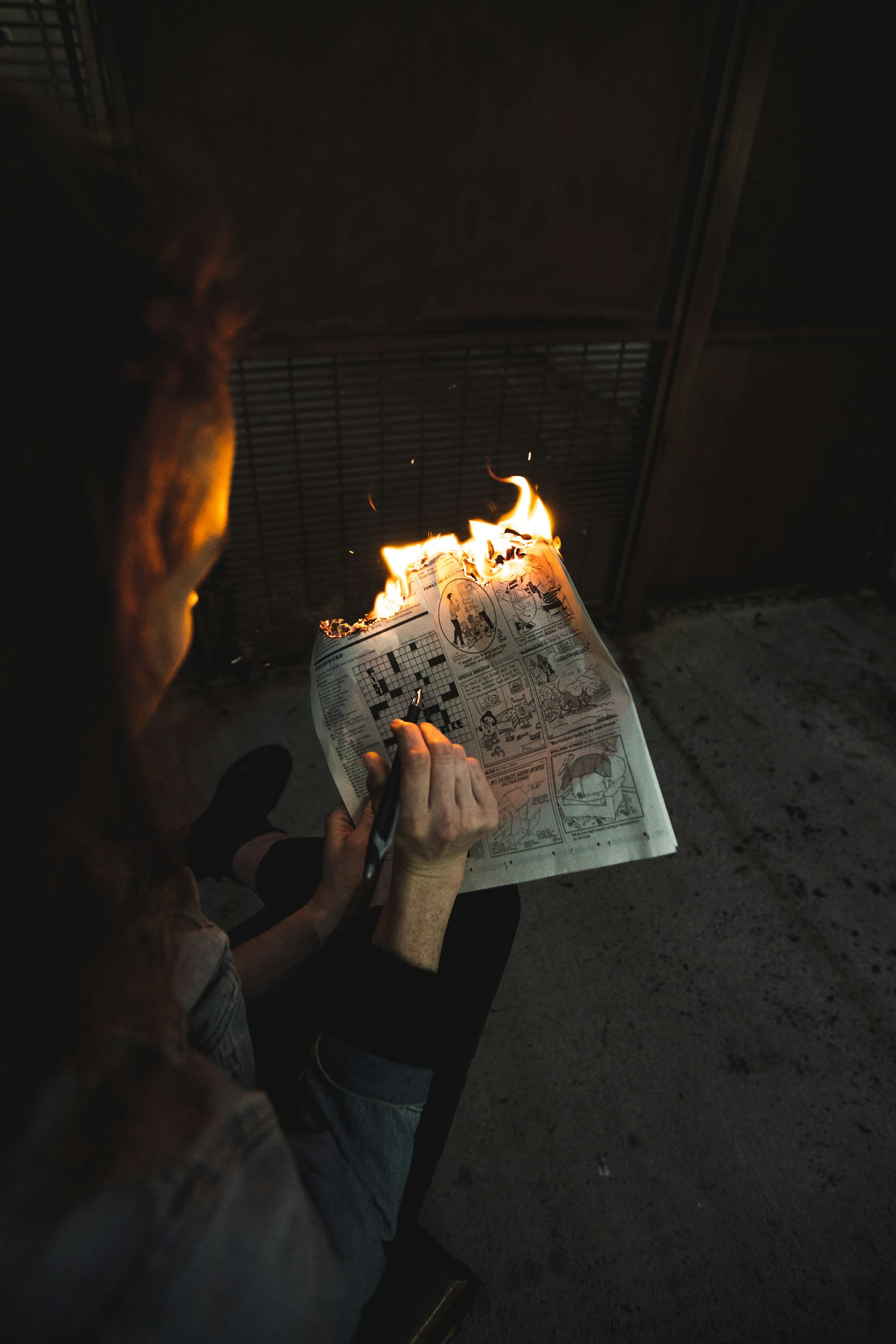Sony a7R III + Canon EF 16-35mm F2.8L II USM sample photo. Person burning newspaper page photography