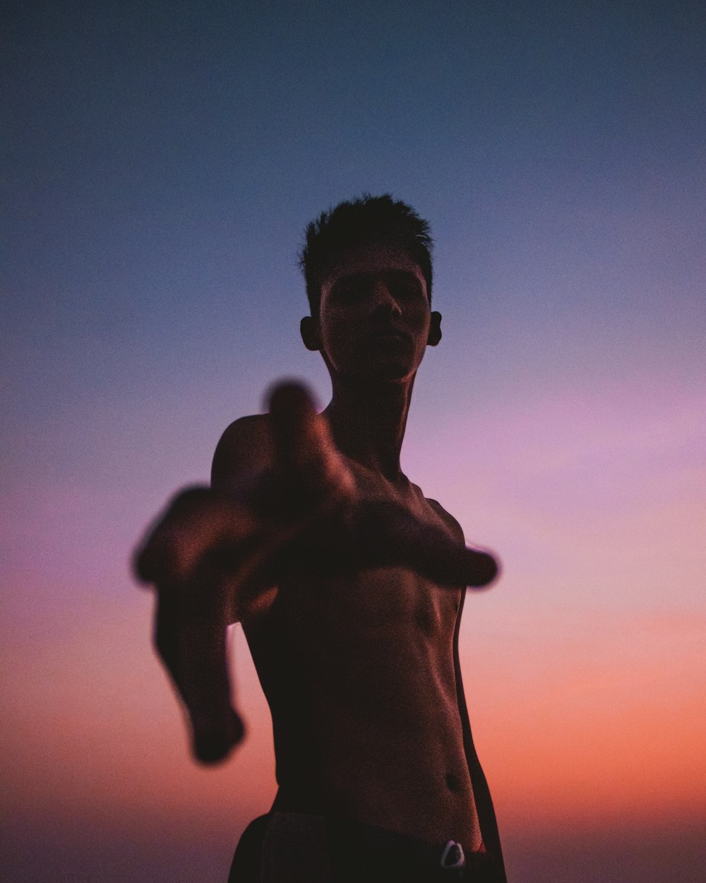 topless man during golden hour