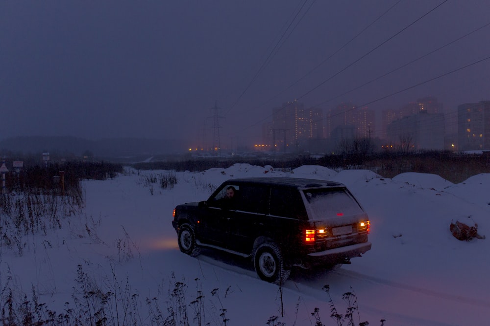 vehicle on roadway covered by snow