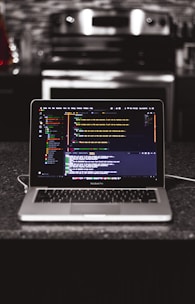 A sleek laptop screen displaying a vibrant recipe plugin integrated into a restaurant website.