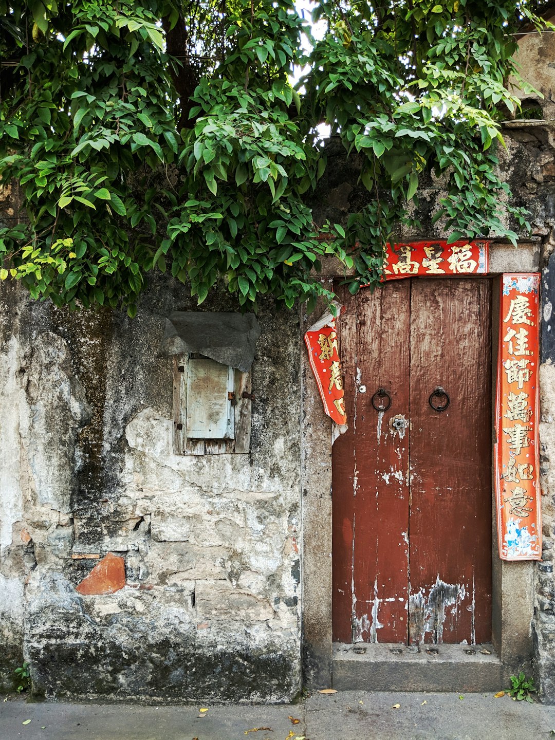 brown wooden door with red signboards