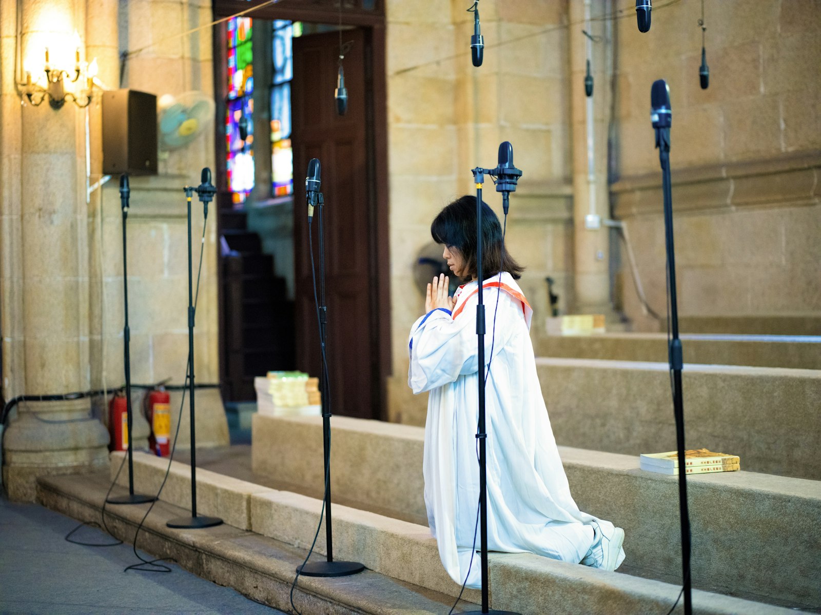 Hasselblad X1D-50c sample photo. Woman praying in cathedral photography