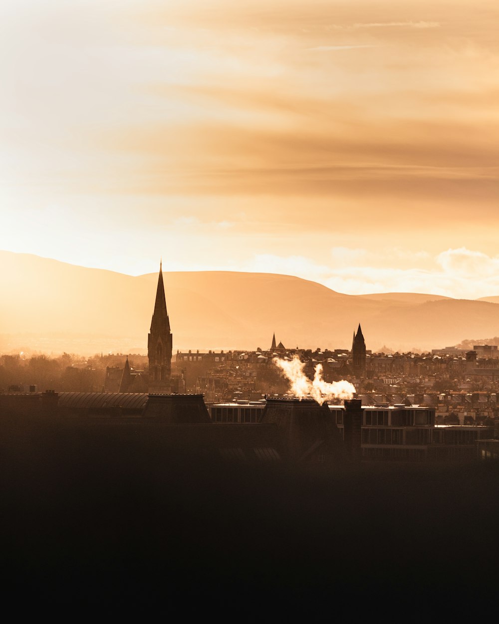 aerial view on town with tower building during golden hour