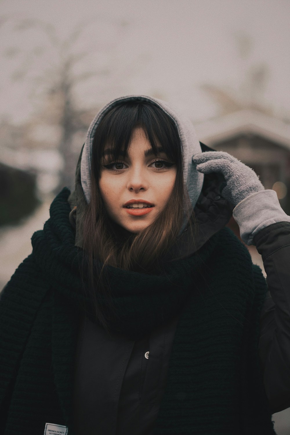 woman wearing black coat