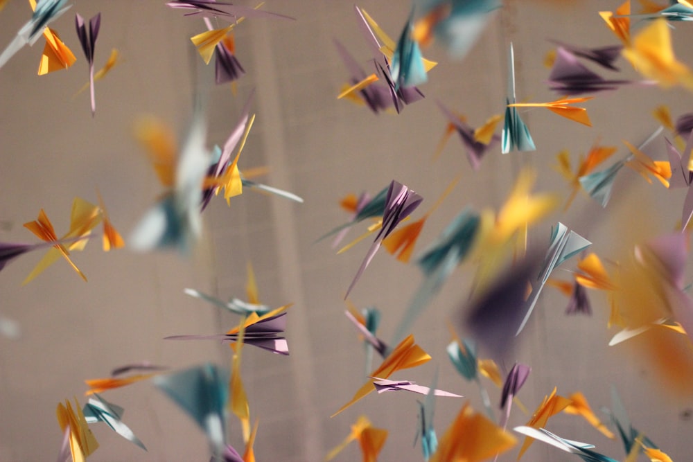 assorted-color paper cranes hanging around the room