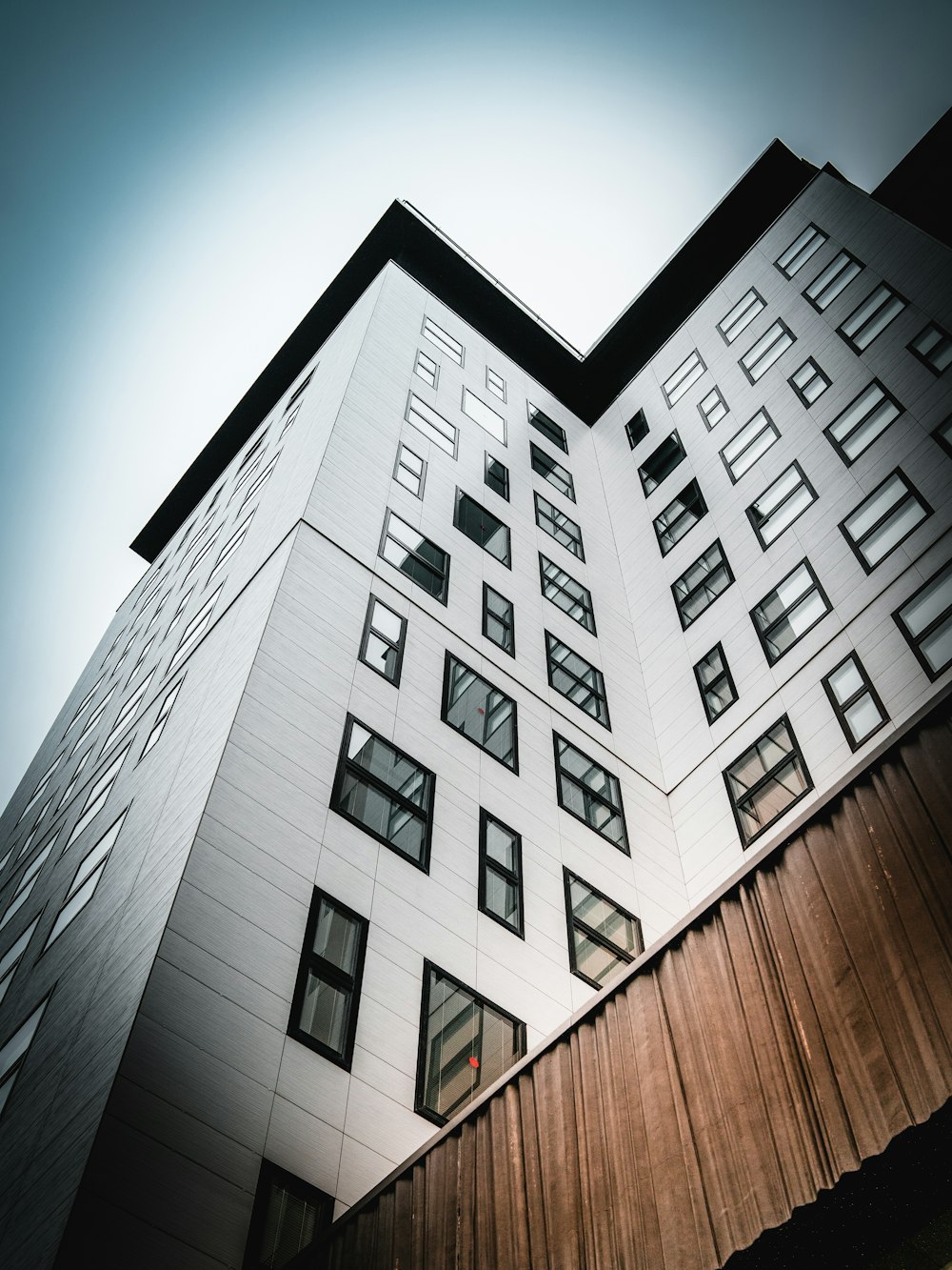 low angle photography of white concrete building during daytime