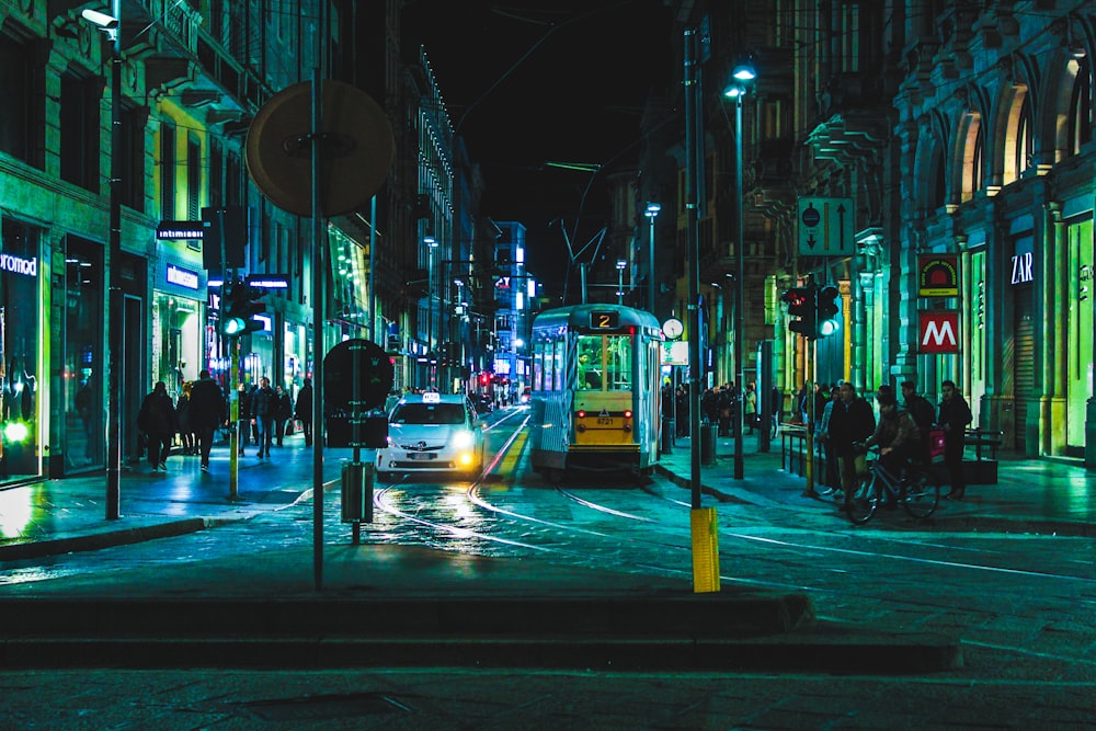 people beside the building during nighttime