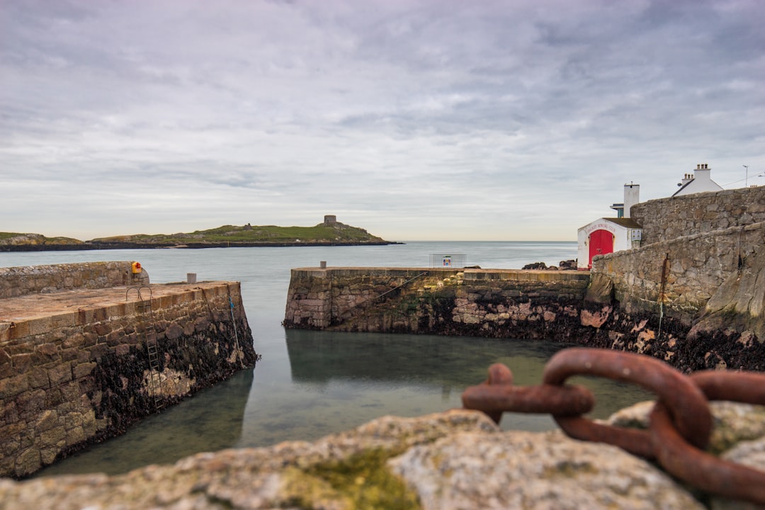 concrete buildings and walls near sea at daytime,