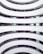 A multi-level building interior with curved balconies lining the central atrium. Each floor has identical balcony designs in white, with walls painted a soft purple. The balconies create an open and airy feeling within the building, while the uniformity adds a sense of modernity.