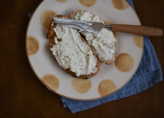 bread with white creme on plate