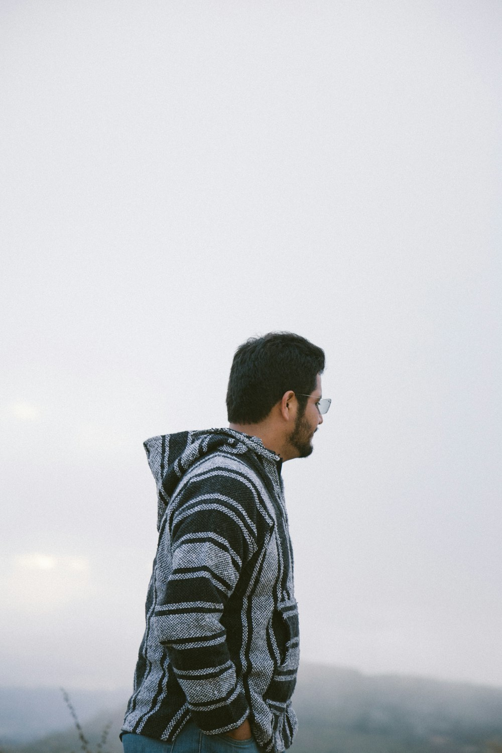 man wearing gray and black jacket