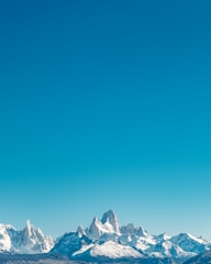 A breathtaking mountain range beneath a clear sky.