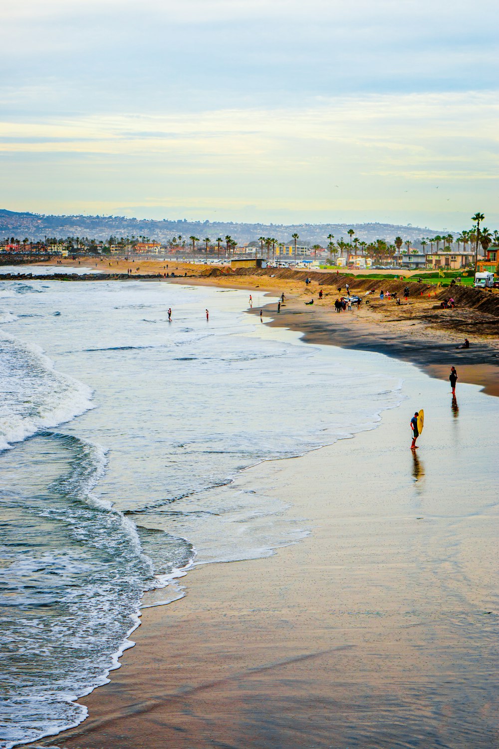 person walking on beach during daytime