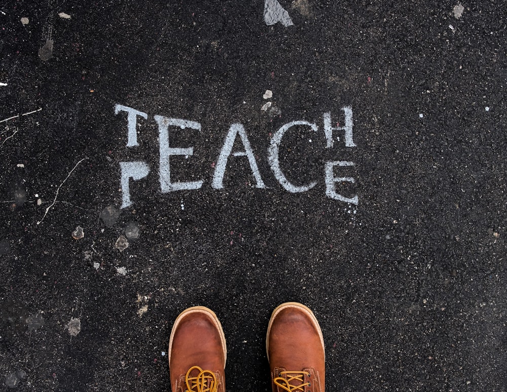 Teach and peace sign on surface