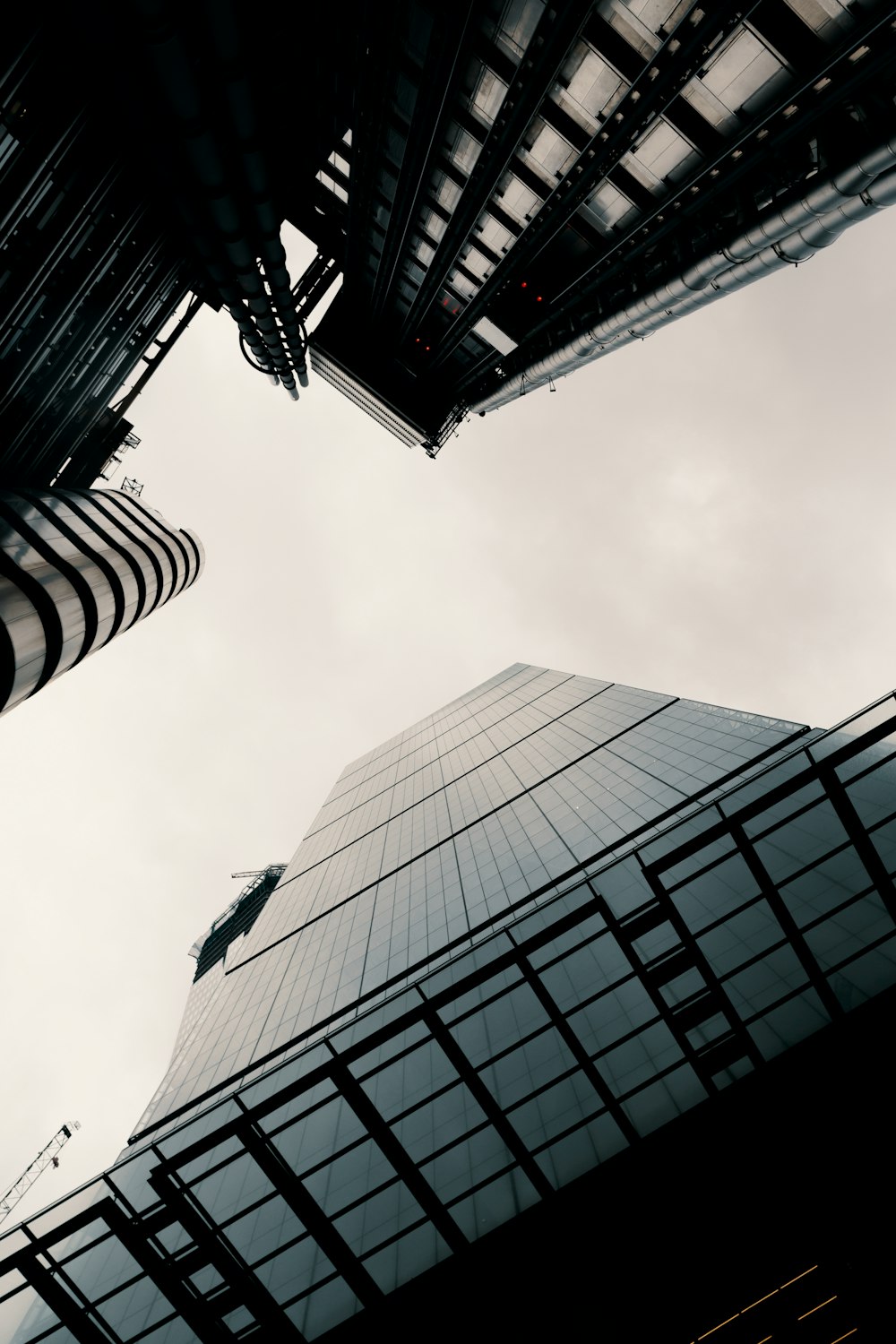 low-angle grayscale photography of curtain wall buildings