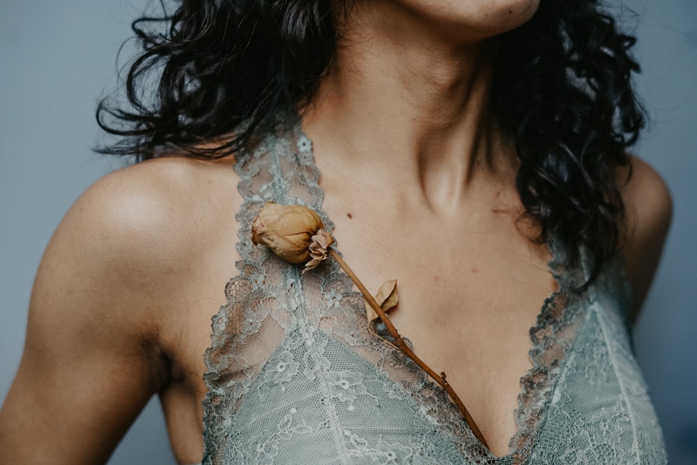 woman wearing gray lace halter top