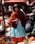 woman holding amber glass bottle