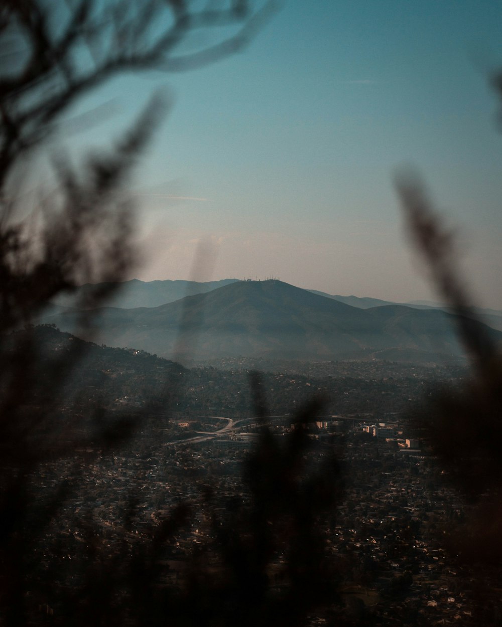 mist mountain under blue sky during daytime